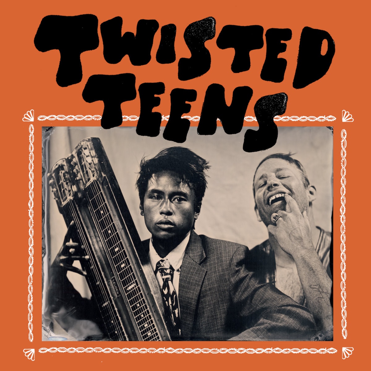 Orange Twisted Teens cover: a black-and-white photo of a man in a suit holding a lap steel guitar beside a laughing man